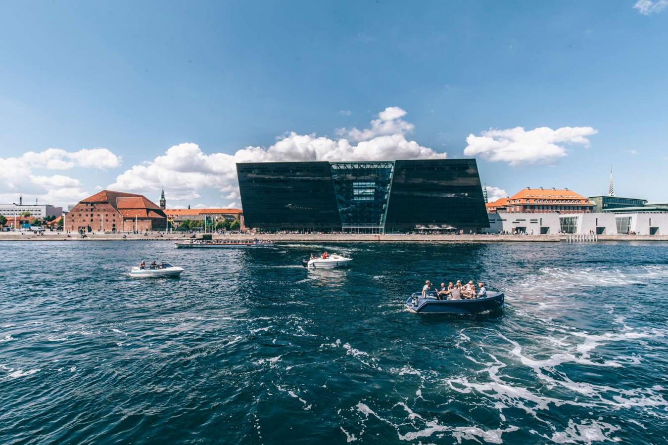 Sightseeing by boat in front of The Black Diamond
