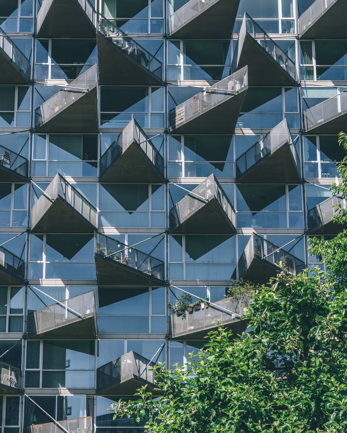 Balconies on the iconic VM Houses overlooking the nature reserve, Amager Fælled, in Copenhagen's Ørestad neighbourhood.