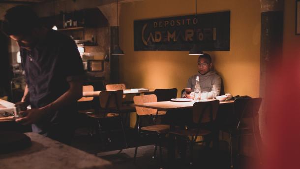 Man sitting at table at Il Buco