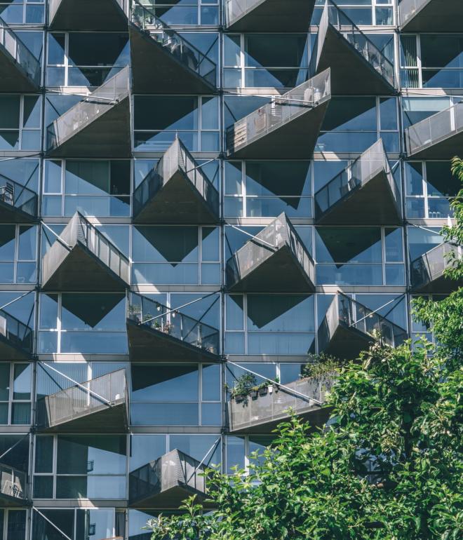 Balconies on the iconic VM Houses overlooking the nature reserve, Amager Fælled, in Copenhagen's Ørestad neighbourhood.